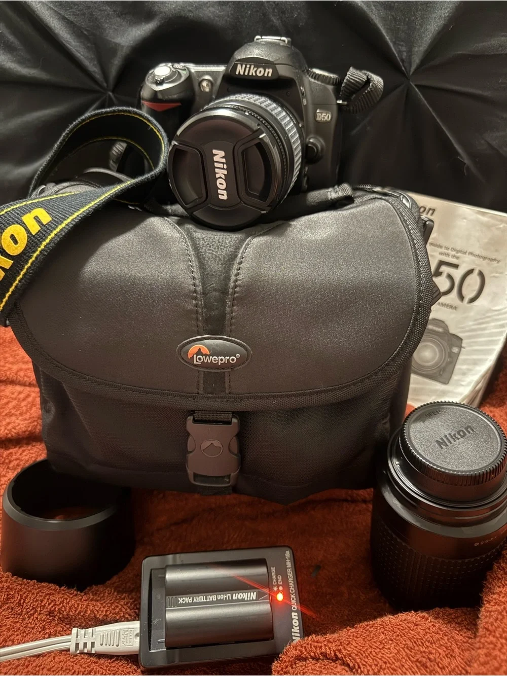 Nikon DSLR Camera Kit with Black Lowepro Bag and Yellow-Accented Strap